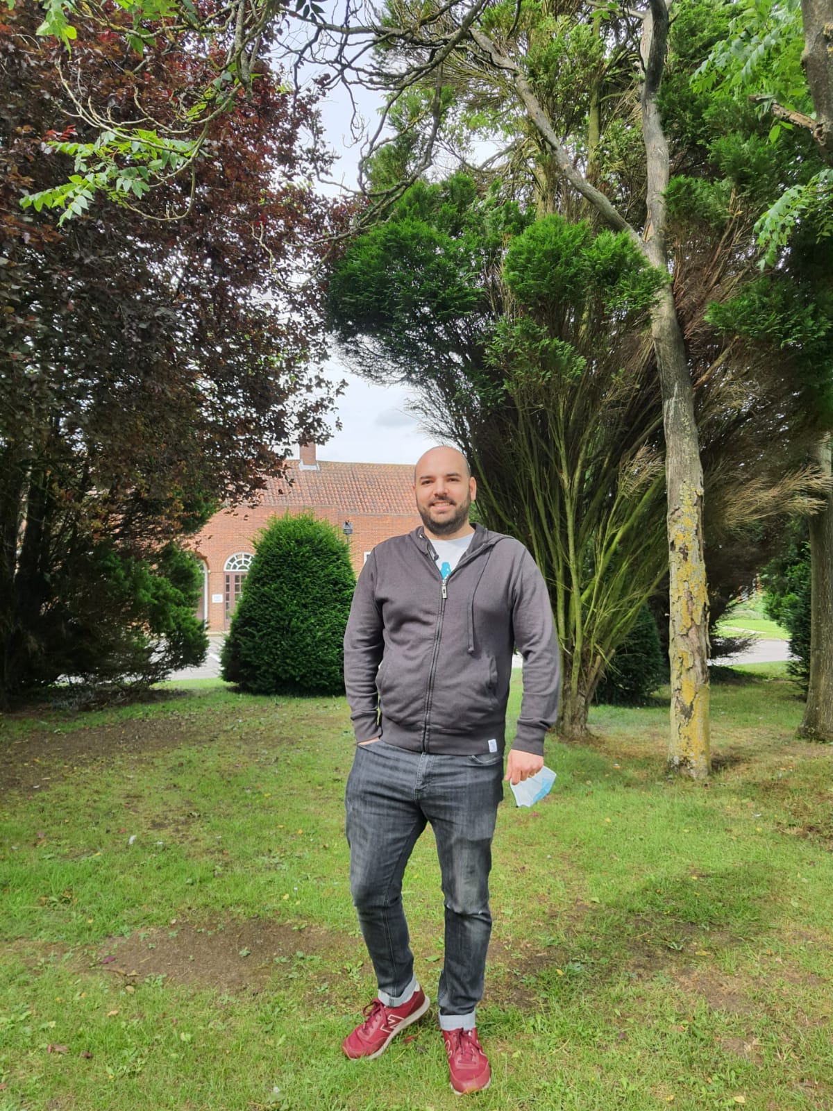 Student standing on lawn