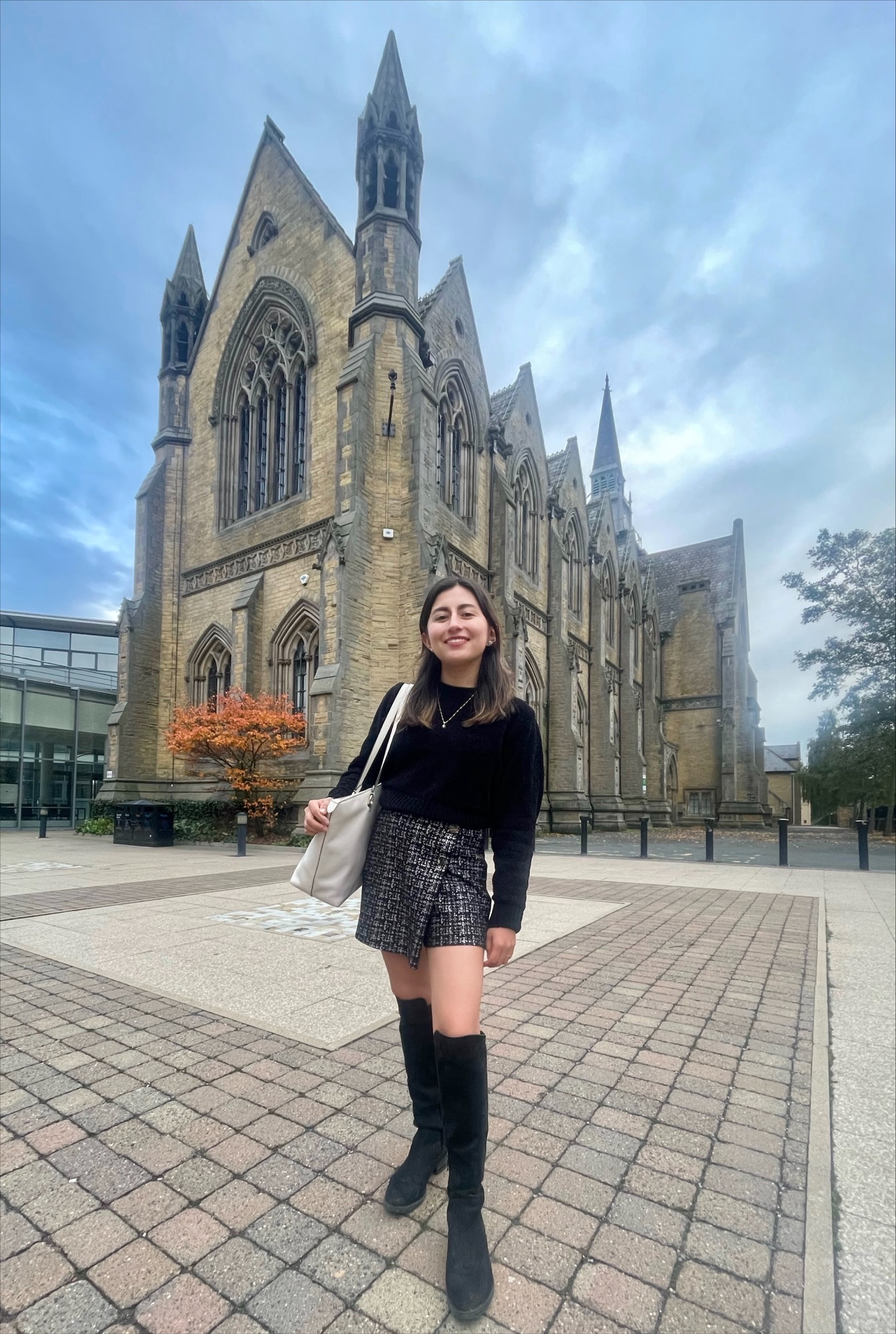 Student standing in front of a cathedral